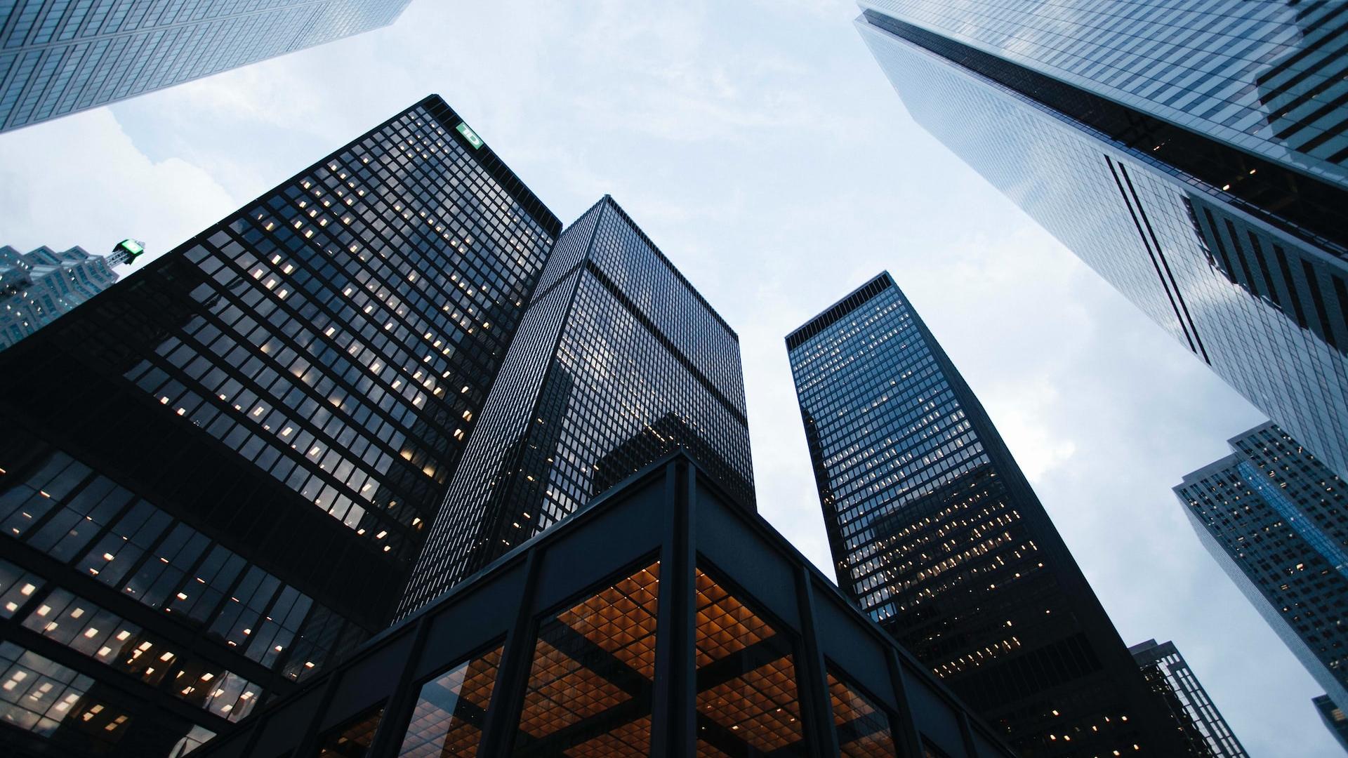 low angle photo of city high rise buildings during daytime